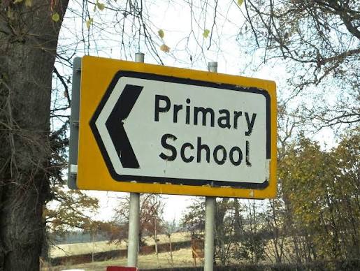 A sign saying primary School to the left